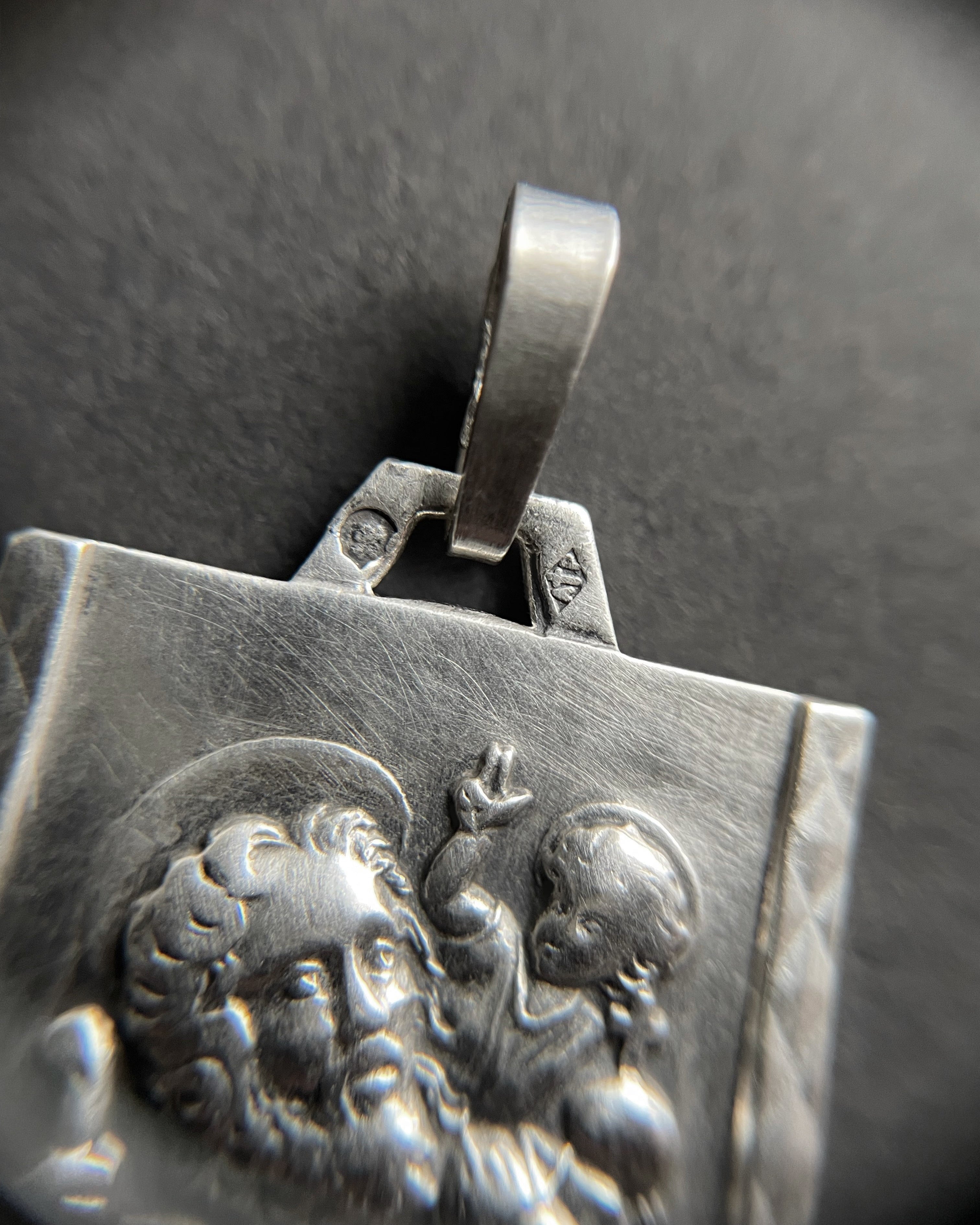 Close-up of French 800 silver St. Christopher pendant showing relief detail and maker’s mark – Auric Vintage