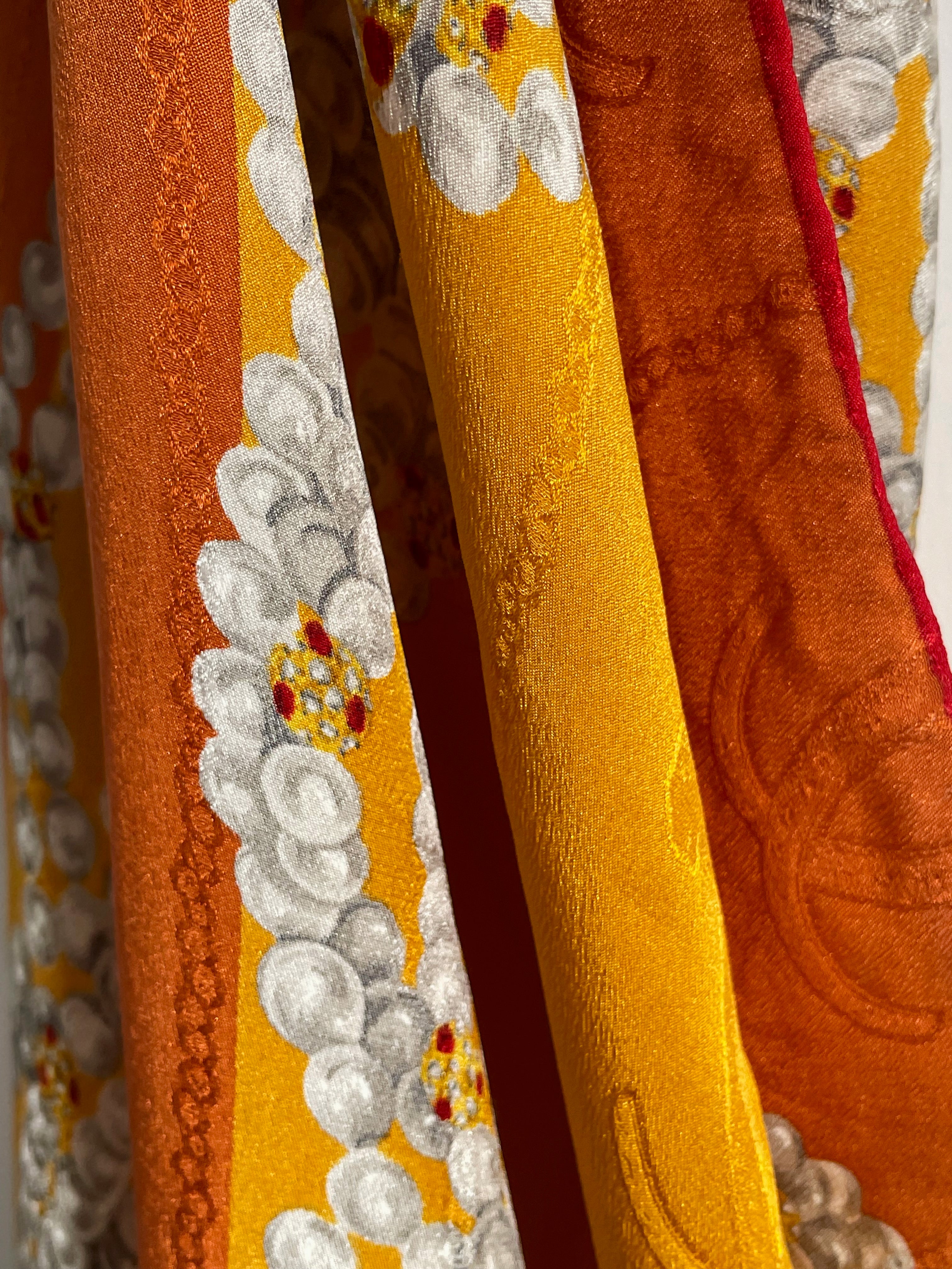 Close-up of vintage Must de Cartier silk scarf showing panther motif and pearl chain detail – Auric Vintage