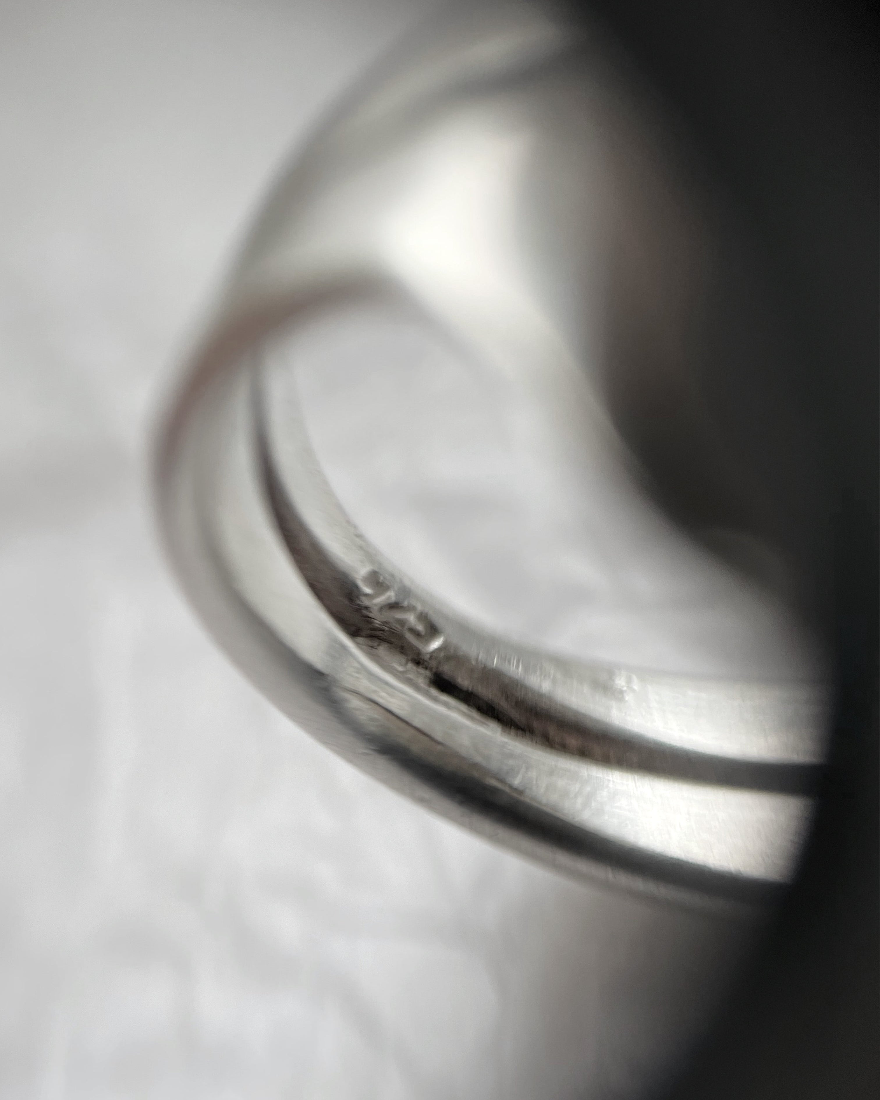 Close-up of vintage sterling silver domed ring showing hallmark and maker’s mark – Auric Vintage