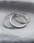 1990s tri-torque bangle in sterling silver with three connected forms and sculptural design – Auric Vintage