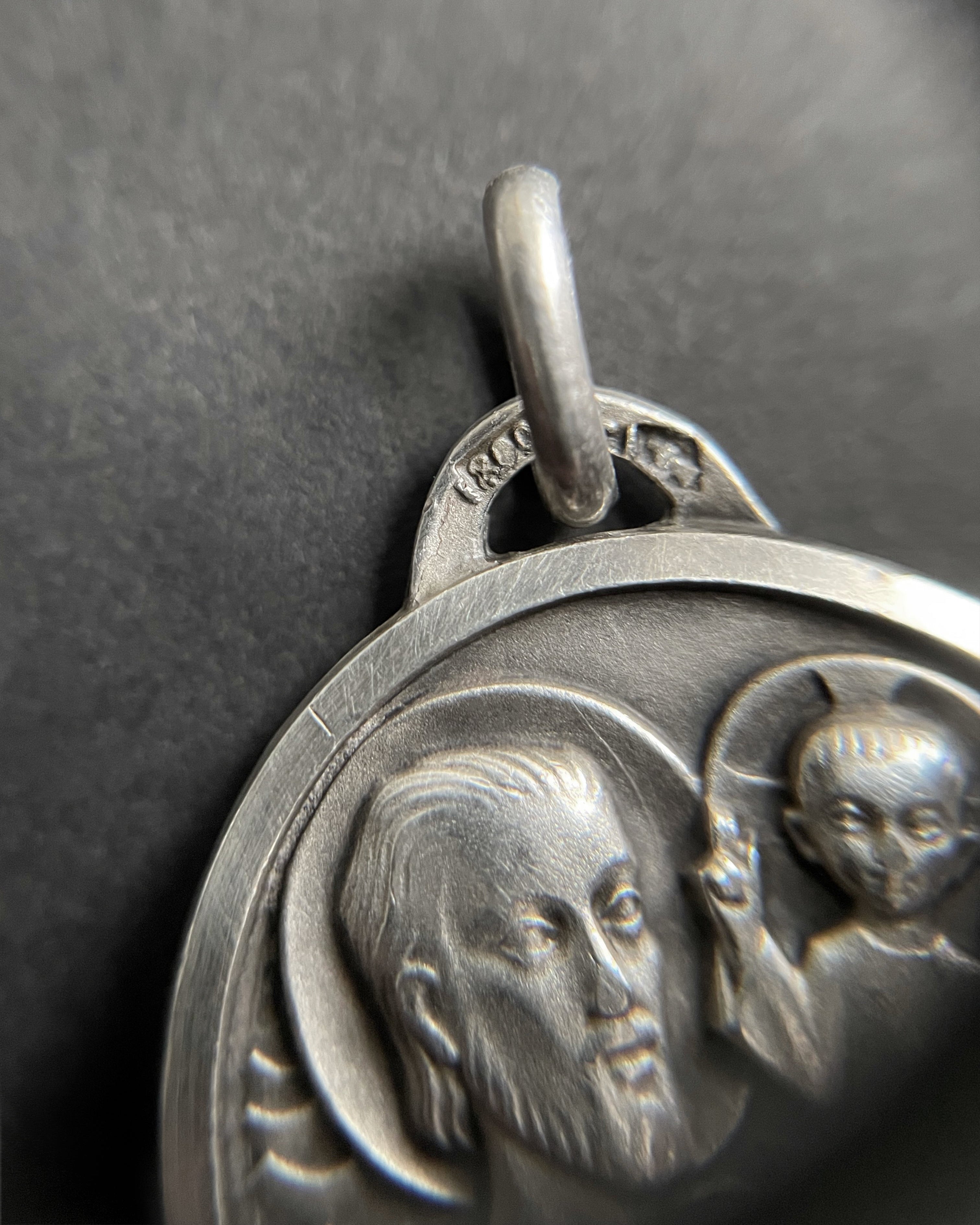 Close-up of silver St. Christopher medallion showing 800 hallmark and maker’s mark – Auric Vintage