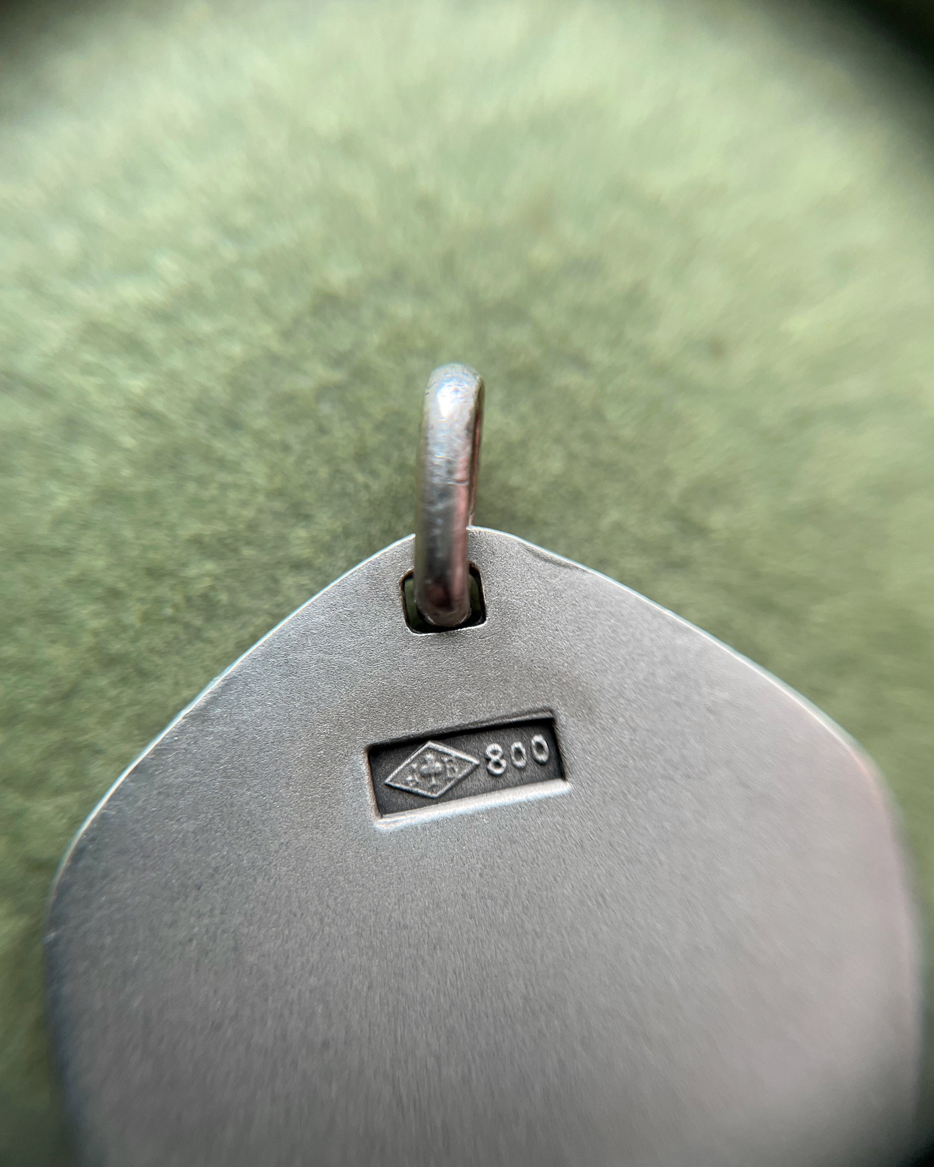 Close-up of 1970s French 800 silver Aries zodiac pendant showing hallmark and Jean Balme maker’s mark – Auric Vintage