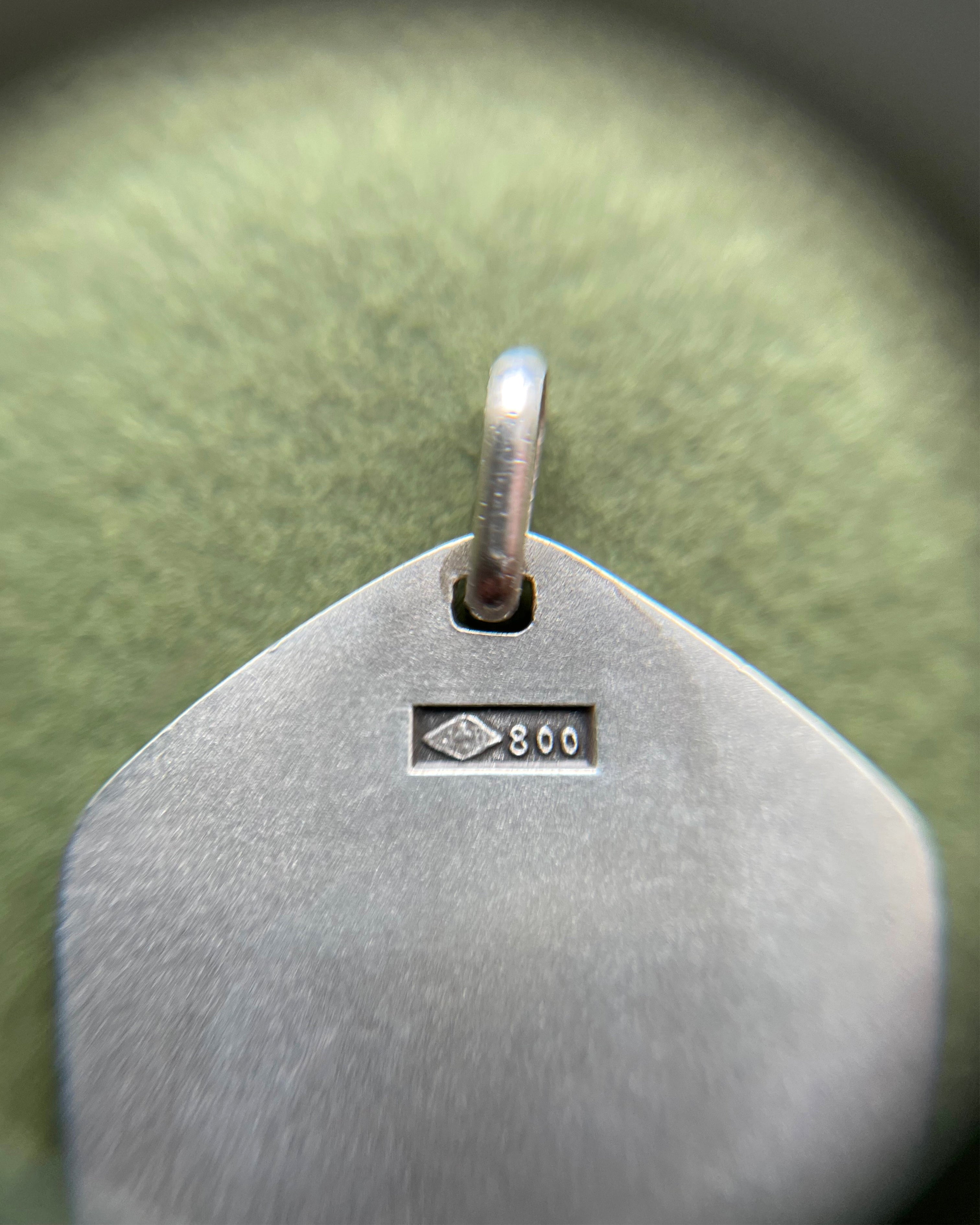 Close-up of 1970s French 800 silver Libra zodiac pendant showing hallmark and Jean Balme maker’s mark – Auric Vintage