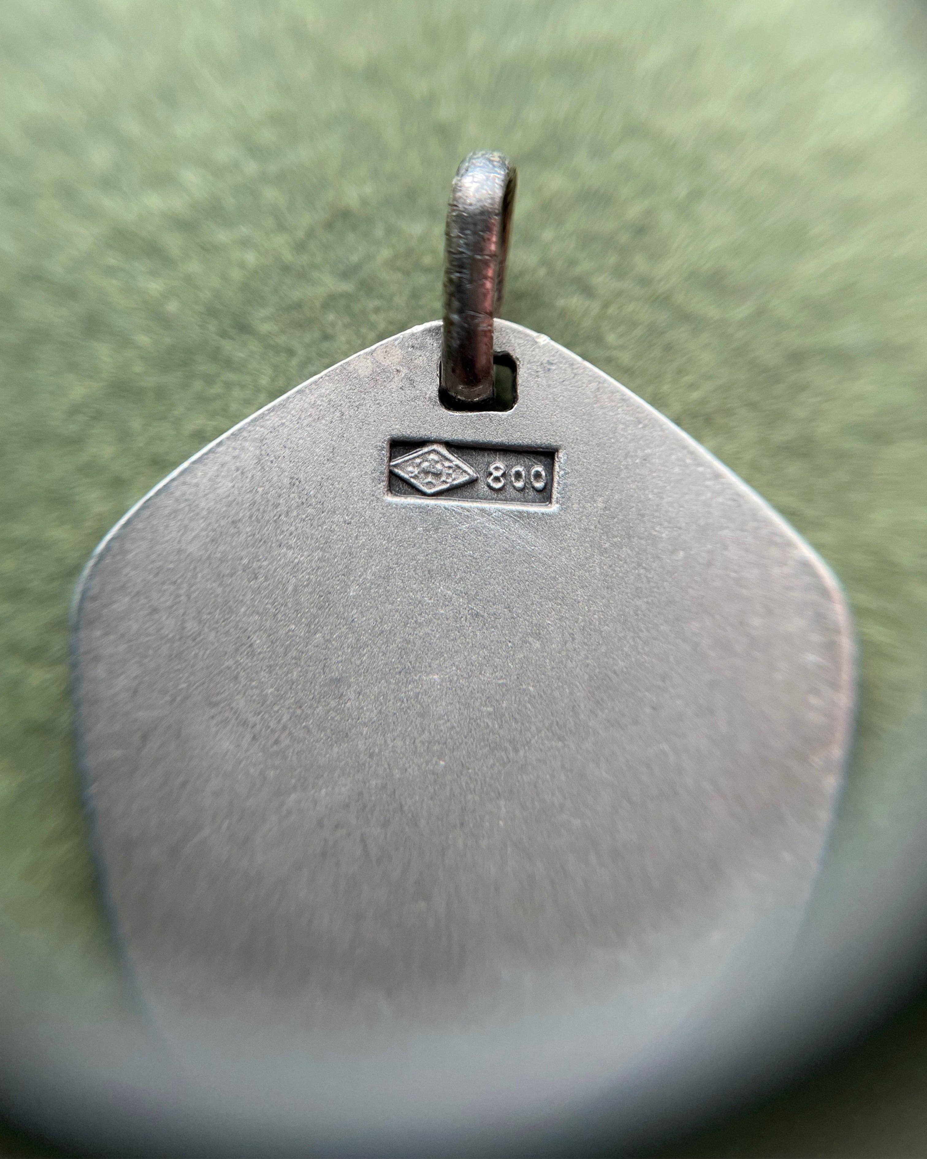 Close-up of 1970s French 800 silver Sagittarius zodiac pendant showing hallmark and Jean Balme maker’s mark – Auric Vintage