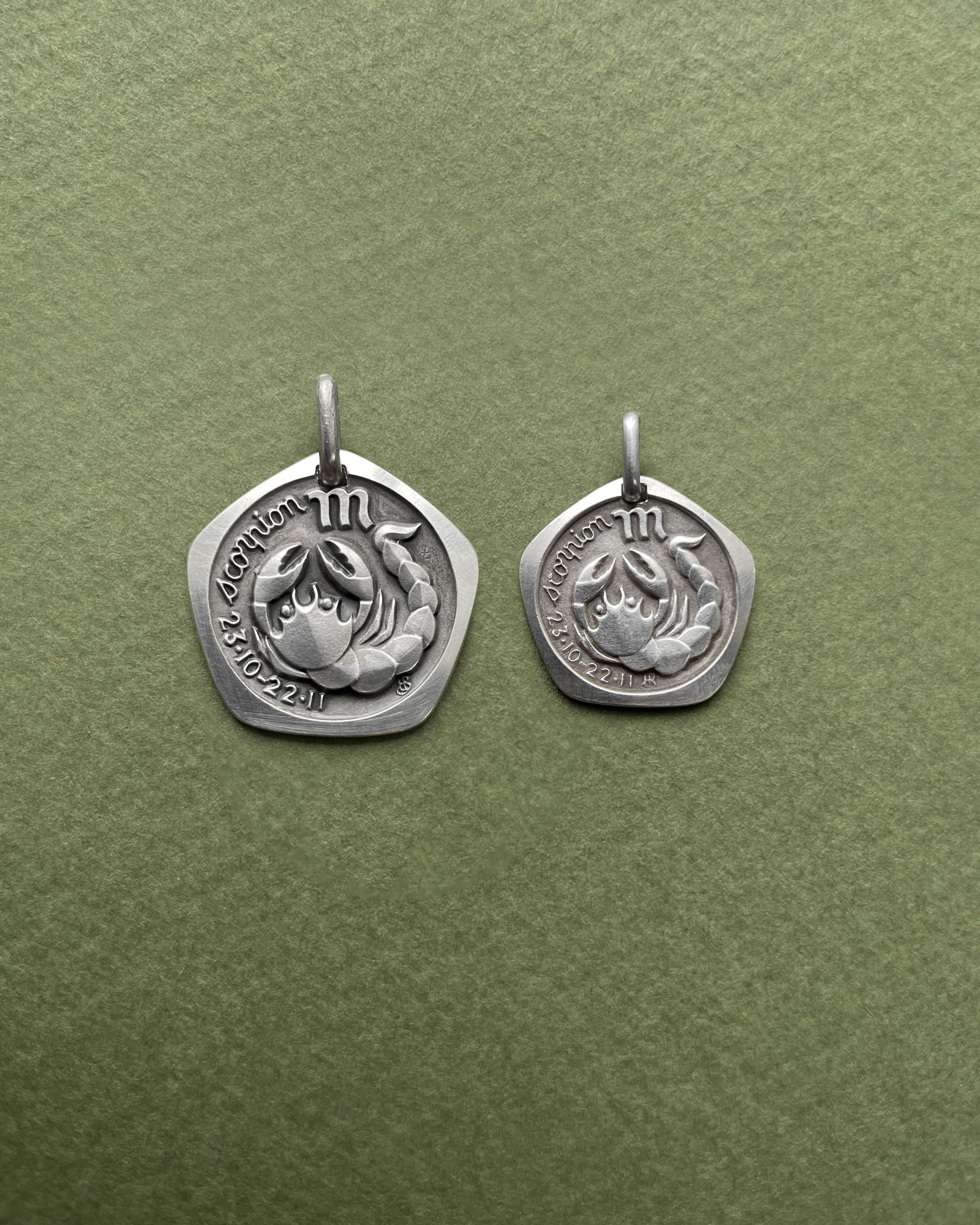 1970s French Scorpio zodiac mini pendant in 800 silver shown next to standard size pendant – Auric Vintage