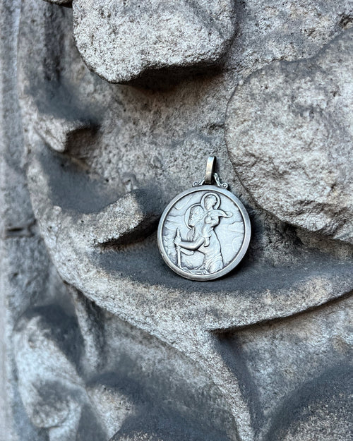 1960s French St. Christopher pendant in silver displayed on shamrock background – Auric Vintage