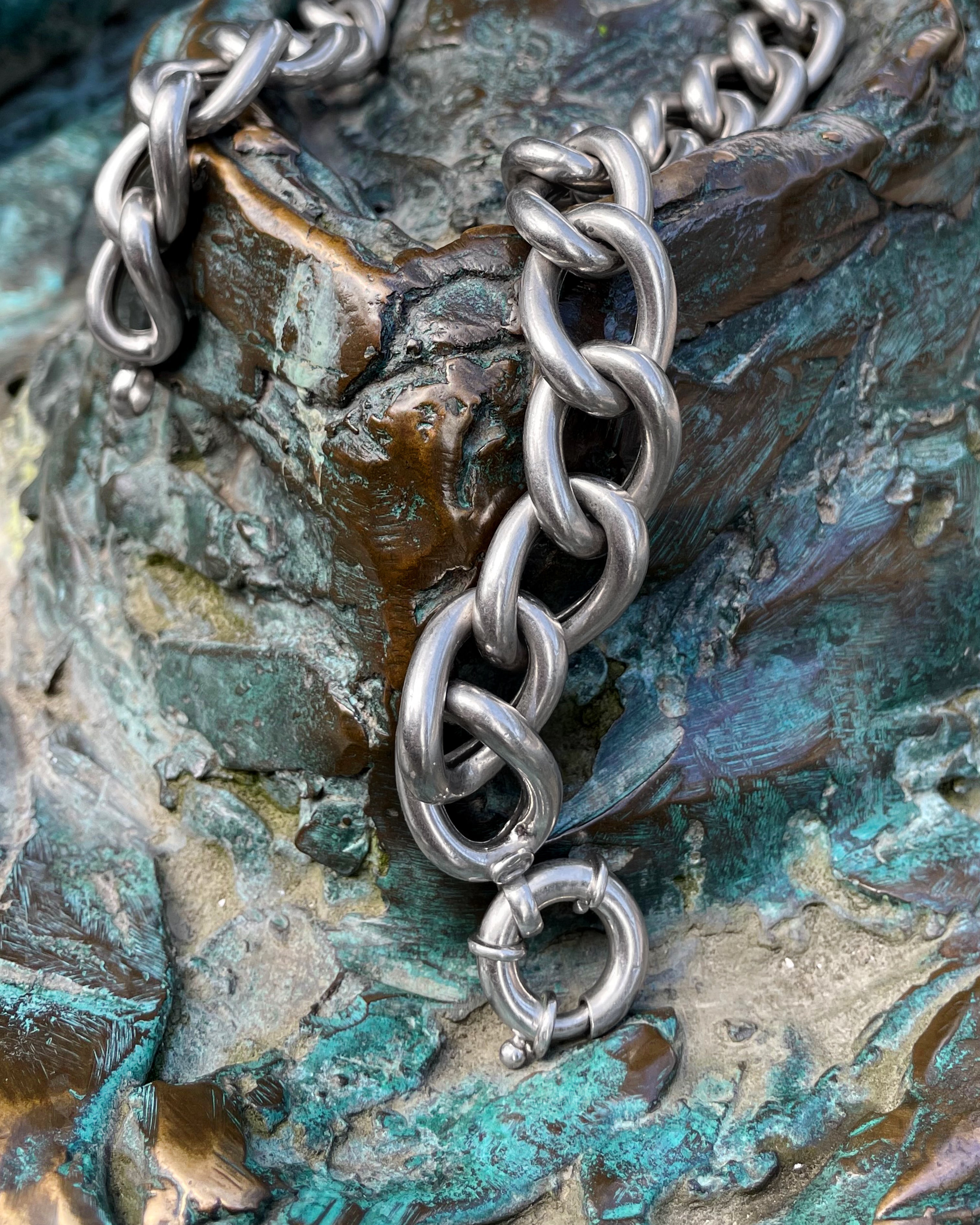 Y2K chunky curb link necklace in sterling silver hanging on chair showing length and drape – Auric Vintage