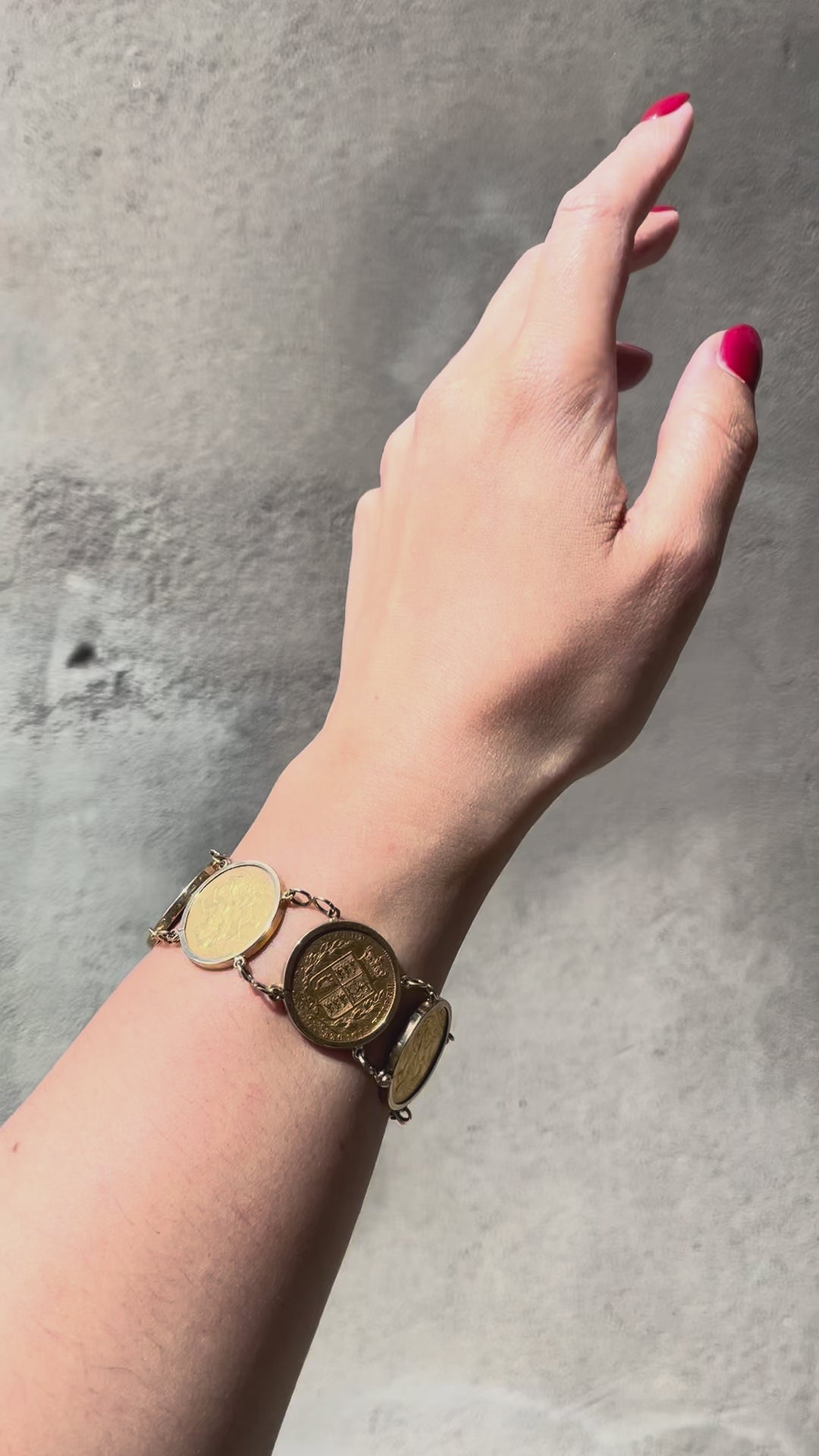 Video of antique six sovereign coin bracelet worn on wrist showing movement and coin detail – Auric Vintage