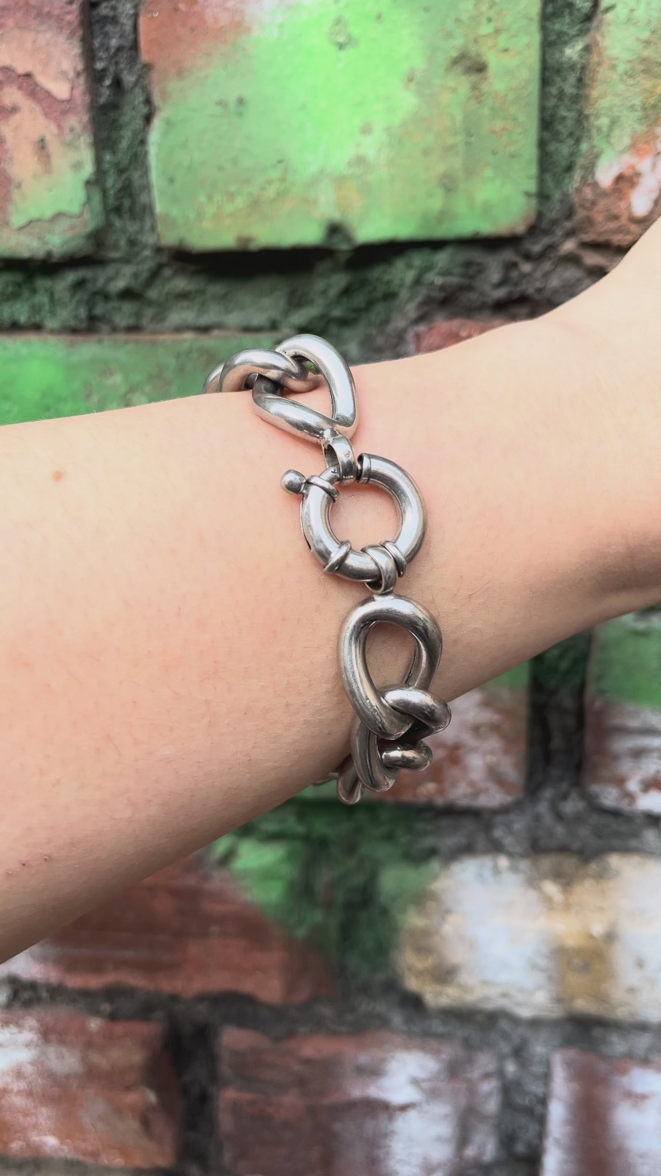 Video of Y2K chunky open curb link bracelet in sterling silver worn on wrist showing movement and polished link detail – Auric Vintage